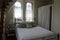 Gorgeous windows and long winding staircase in bedroom, Oneida Community Mansion House, 2018