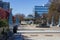 A gorgeous winter landscape at the Decatur Square with red and yellow autumn trees, lush green trees, a round blue pergola