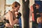 Gorgeous woman, mma fighter in gym during training. Preparing for a hard caged match