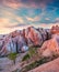 Gorgeous world of Cappadocia. Picturesque spring sunset in Red Rose valley in April. Cavusin village located, district of Avanos