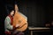 Gorgeous young woman in ukrainian traditional costume with ukrainian musical instrument bandura