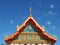 Gorgeously crafted temple gable soaring into blue sky