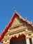 Gorgeously crafted temple gable soaring into blue sky