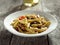 Gorgonzola cheese in pasta with beef and red bell