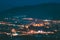 Gori, Shida Kartli Region, Georgia. Gori Fortress In Cityscape In Evening Illumination Under Blue Sky. Travel