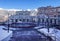 Gorky Gorod mountain ski resort townscape. Hotels on scenic snowy Caucasus mountain peaks background under blue sky at winter.