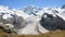 Gornergrat Summith. Glacier View And Wild Flowers In Summer