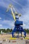 Gorodets, Russia. - June 2.2016. Blue portal crane with a yellow arrow on the cargo wharf in Gorodets about Gateway.