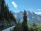 Gosau - Gravelled road in the mountains with the view on high Alps in the region of Gosau, Austria.