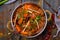 Gosht masala indian food in a copper on blue wooden table top view