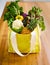 Got a bag full of goodness. Shot of an assortment of fruit and vegetables in a shopping bag.