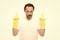 got an idea. He will cope with any task. mature man wear rubber gloves. man cleaning home. care your hands while washing