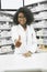 We always got your heath covered. Portrait of a cheerful young female pharmacist showing thumbs up while looking at the