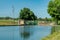 Gota canal with crossing bridge in summer sunshine