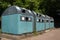 Gothenburg, Sweden - June 9, 2020: Swedish recycling station with turquoise colored bins in Hisingen, northern suburbs of