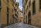 Gothic buildings on a narrow street in Centro Storico of Florence, Italy