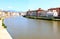 Gothic church along river Arno in Pisa, Italy