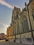 Gothic church Basilica of our Lady at the main square in Tongeren, Belgium, at sunset with a clear blue sky
