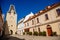 Gothic clock tower Mikulov Gate, Narrow picturesque street with colorful renaissance and baroque buildings in historic center in