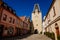 Gothic clock tower Mikulov Gate, Narrow picturesque street with colorful renaissance and baroque buildings in historic center in