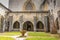 Gothic cloister of the thirteenth century and in the background the chapel of San Agustin in the city of Roncesvalles. Navarre Spa