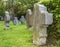 Gothic cross and tomb in cemetery at Saint-Hubert church, Aubel