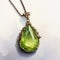 Gothic Illustration Pendant With Green Peridot Gemstone