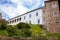 Gothic medieval castle Velhartice, sunny day, white mansion, facade with arches, masonry wall, old stronghold with tower,