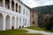 Gothic medieval castle Velhartice, sunny day, white mansion, facade with arches, masonry wall, old stronghold with tower,