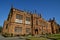 Gothic revival style facade of classic and historic school building with red sandstone at University of Sydney, Australia