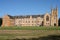 Gothic revival style facade of classic and historic St John`s College with beige stone at University of Sydney, Australia