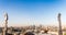 Gothic spire on the roof of Milan Dome with city landscape as background. Milan, Italy.