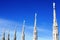 Gothic spires on blue sky background