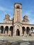 Gothic stone tower church cathedral entry entrance stairs belgrade serbia religous beliefing cross winter snow melting