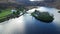 Gougane Barra, County Cork, Ireland, where water flows gracefully around a historic chapel