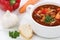 Goulash soup with meat, baguette closeup