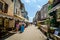 Gourdon, France - June 20, 2018. Street with tourists in typical french village
