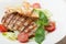 Gourmet caesar salad with grilled meat fillet, cherry tomatoes,