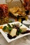 Gourmet cheese plate with garnishes