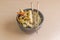 gourmet chinese food with chopsticks. in bowl with fried rice, chicken, vegetables, chun kun,