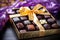 gourmet chocolates in a gold box with satin ribbon