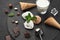 Gourmet creamy and chocolate ice cream served on a stone slate over a black background.