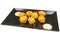 Gourmet crispy fried chicken balls with sauce, on a black plate