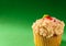 Gourmet Cupcake on Green Background