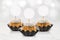 Gourmet Cupcake Mockup with Three Gold Cupcakes