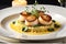 Gourmet Dinner Plated Elegantly on a White Porcelain Dish: Seared Scallops Nestling Atop a Bed of Saffron-infused Risotto