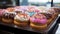 Gourmet donut with multi colored icing and candy generated by AI