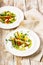 Gourmet fish salad. Pangasius dori fillet, vegetables, avocado pate, mozzarella and fresh herbs. Restaurant serving. Chef`s dish