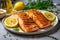 Gourmet food composition grilled and smoked striped bass on rustic wooden board