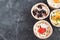Gourmet food Snack Tartlet Creamy goat cheese Dried Fruit Appetizer Dark concrete background Copy space